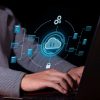 Vertical photo of a Man uses cloud computing on his computer to transmit.